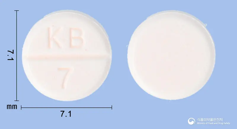네오트린정(테라조신염산염수화물) 앞뒤 사진 (주황색 원형, 각인 KB 7)