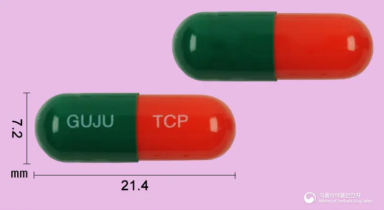 타코펜캡슐 앞뒤 사진 (초록색 캡슐, 각인 GUJU TCP)