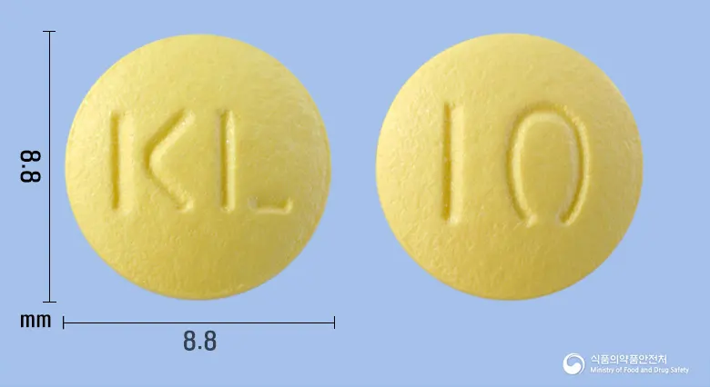 도네프정10밀리그램(도네페질염산염수화물) 앞뒤 사진 (노란색 원형, 각인 KL / 10)
