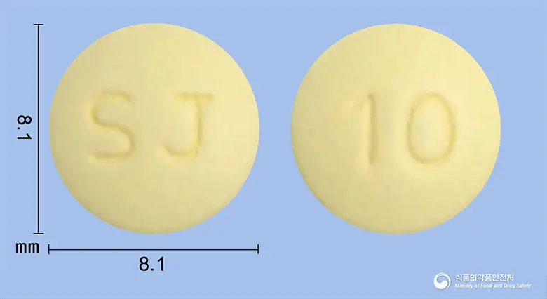 뉴토인정(도네페질염산염수화물) 앞뒤 사진 (노란색 원형, 각인 SJ / 10)