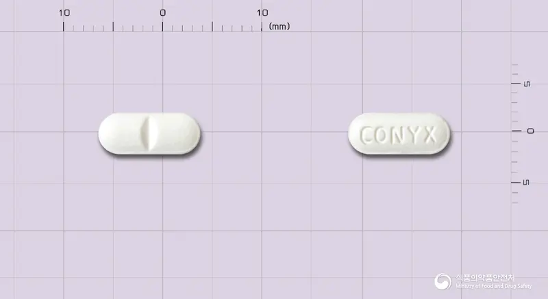 코닉스정(주석산졸피뎀) 앞뒤 사진 (흰색 장방형, 각인 CONYX)