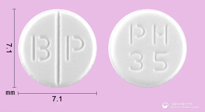 펜홀드정(펜디메트라진타르타르산염) 앞뒤 사진 (흰색 원형, 각인 B P / PH35)