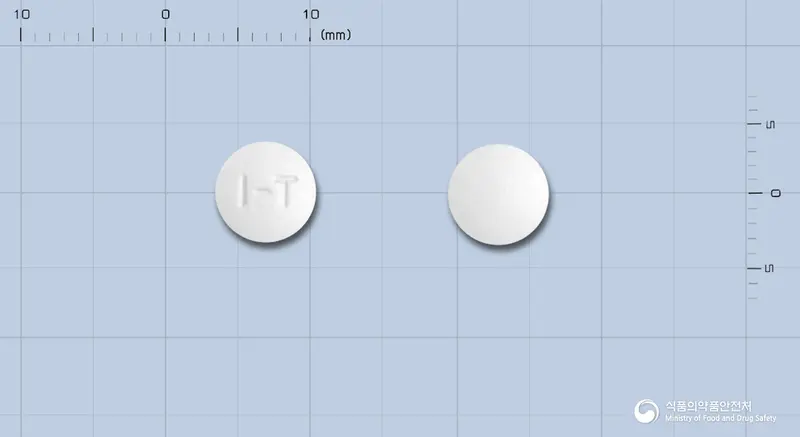 푸리드정(이토프리드염산염) 앞뒤 사진 (흰색 원형, 각인 I-T)