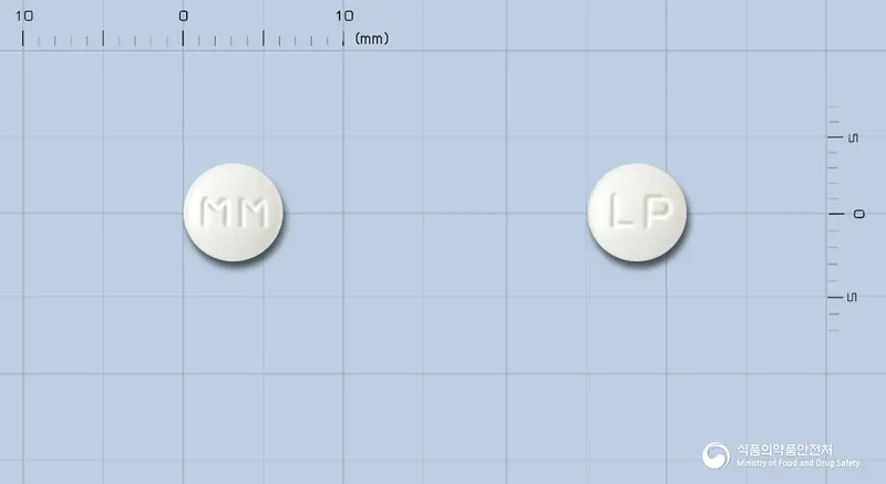 명문레보설피리드정 앞뒤 사진 (흰색 원형, 각인 MM / LP)