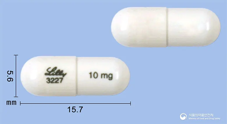 스트라테라캡슐10밀리그램(아토목세틴염산염) 앞뒤 사진 (흰색 캡슐, 각인 10mg3227)