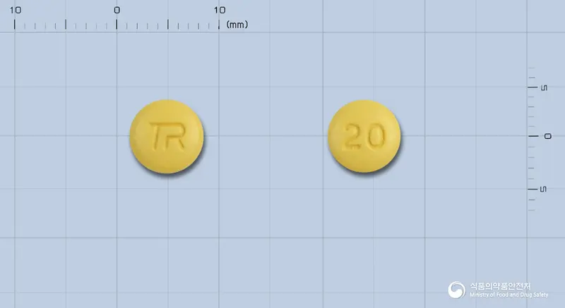 라베트정20mg(라베프라졸나트륨) 앞뒤 사진 (노란색 원형, 각인 20)