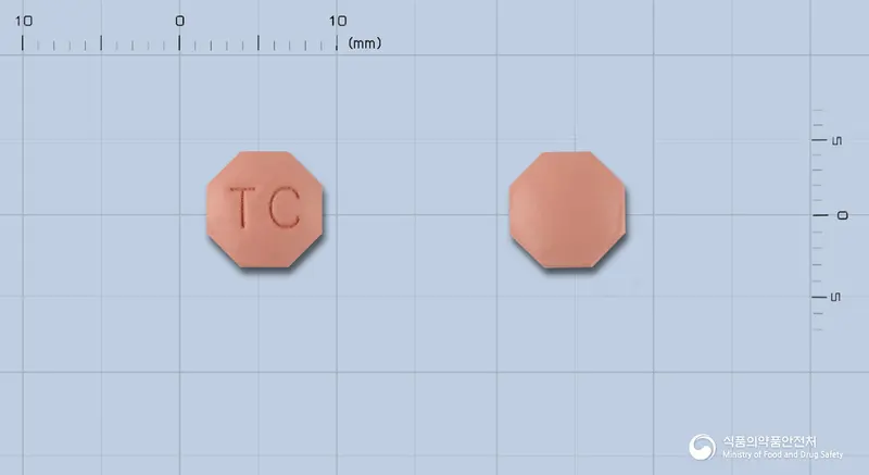 마이시아정(피나스테리드) 앞뒤 사진 (분홍색 팔각형, 각인 TC)