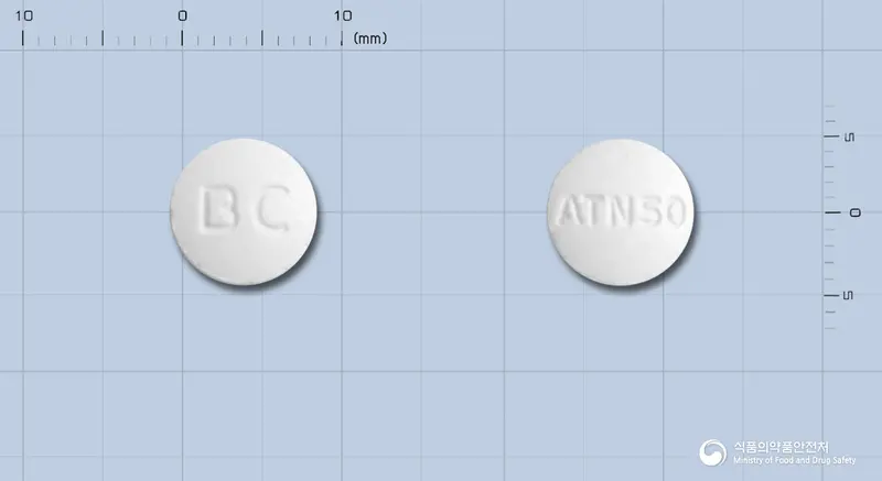 비씨아테놀올정50mg 앞뒤 사진 (흰색 원형, 각인 BC / ATN50)