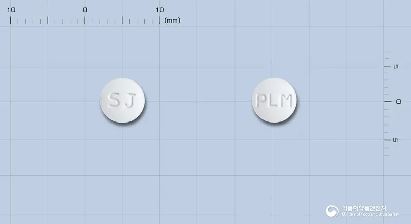 프리몬정(리마프로스트알파덱스) 앞뒤 사진 (흰색 원형, 각인 SJ / PLM)