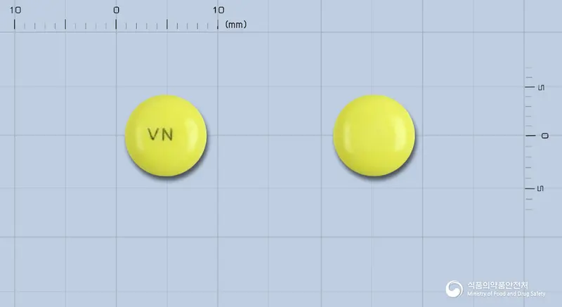바소디엔정100mg(니카메테이트시트르산염) 앞뒤 사진 (노란색 원형, 각인 VN)
