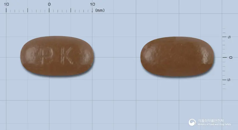 펜타올정 앞뒤 사진 (갈색 타원형, 각인 PK)