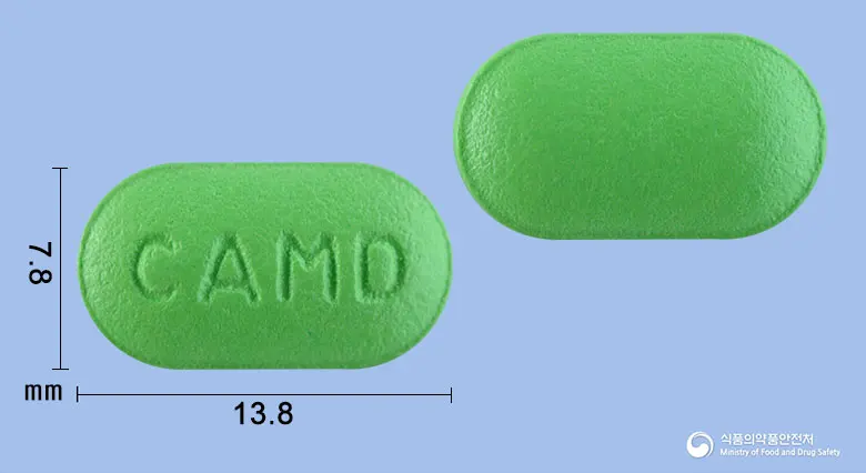메디다제정 앞뒤 사진 (연두색 장방형, 각인 CAMD)