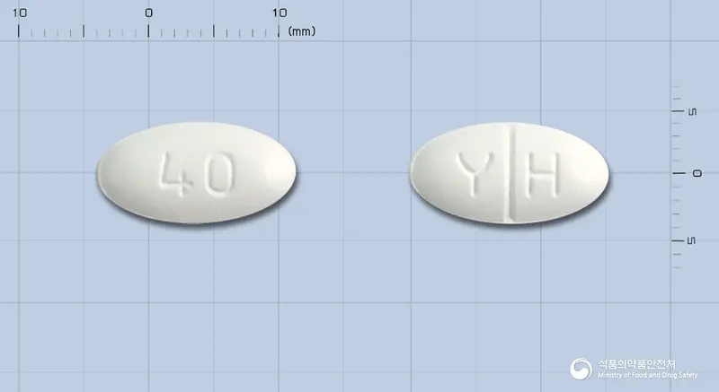 아토르바정40밀리그램(아토르바스타틴칼슘삼수화물) 앞뒤 사진 (흰색 타원형, 각인 40 / Y H)