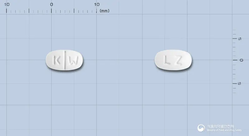레티잘정(레보세티리진염산염) 앞뒤 사진 (흰색 타원형, 각인 K W / LZ)