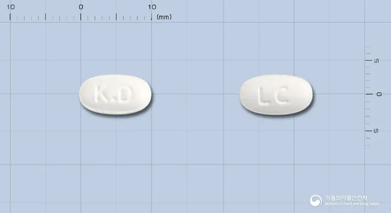 레보큐정(레보세티리진염산염) 앞뒤 사진 (흰색 타원형, 각인 K.D / LC)