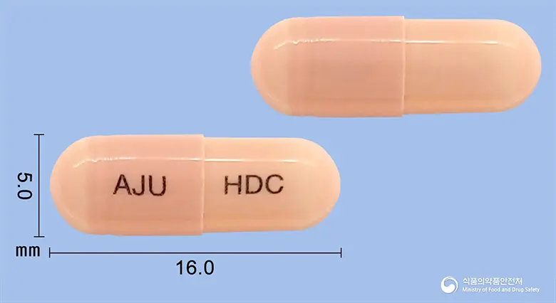 하이디놀캡슐100밀리그램(세프디니르일수화물) 앞뒤 사진 (분홍색 캡슐, 각인 AJU HDC)