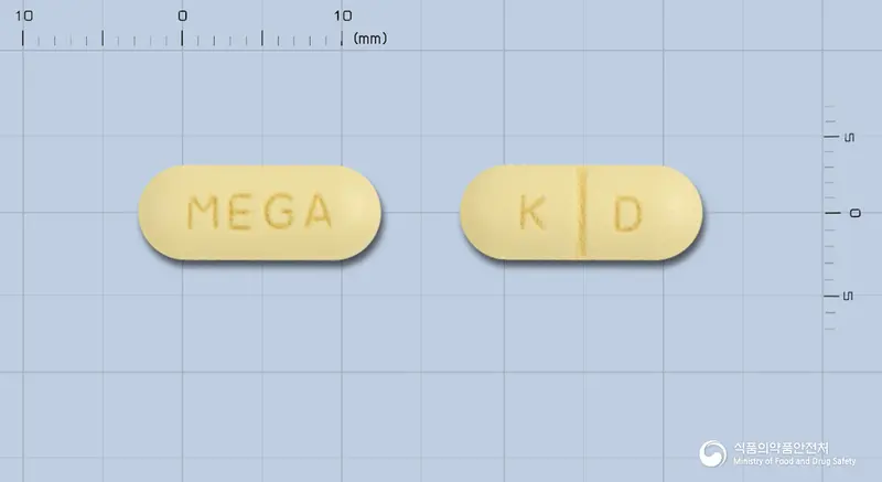 메가스펜정 앞뒤 사진 (노란색 장방형, 각인 MEGA / K D)