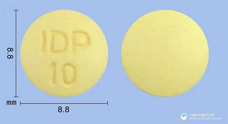 디멘셉트정10밀리그램(도네페질염산염수화물) 앞뒤 사진 (노란색 원형, 각인 IDP10)
