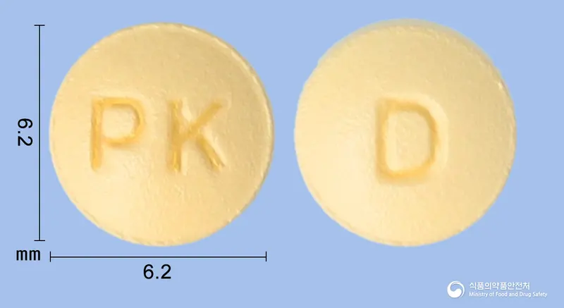 레도핀정(레르카니디핀염산염) 앞뒤 사진 (노란색 원형, 각인 PK / D)