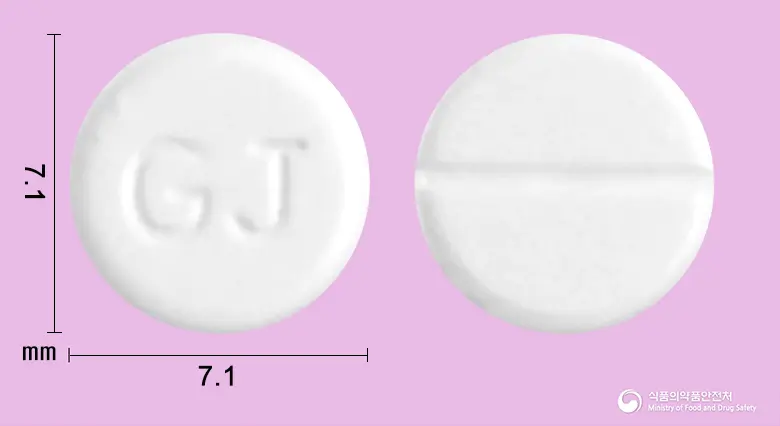 펜디민정(펜디메트라진타르타르산염) 앞뒤 사진 (흰색 원형, 각인 GJ)