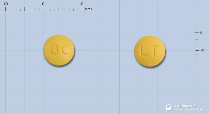 레토졸정50밀리그람(레토스테인) 앞뒤 사진 (노란색 원형, 각인 BC / LT)
