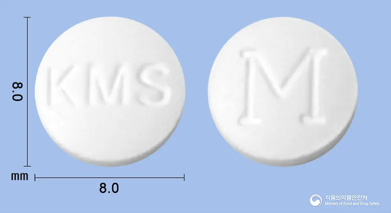 맨포틴정(트리메부틴말레산염)(수출용) 앞뒤 사진 (흰색 원형, 각인 KMS / M)