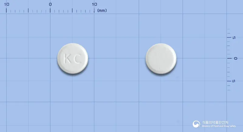 엘다임오디정5밀리그램(도네페질염산염일수화물) 앞뒤 사진 (흰색 원형, 각인 KC)