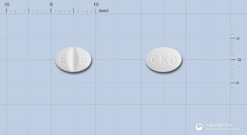 에스시탈정10밀리그램(에스시탈로프람옥살산염) 앞뒤 사진 (흰색 타원형, 각인 E S / CKD)