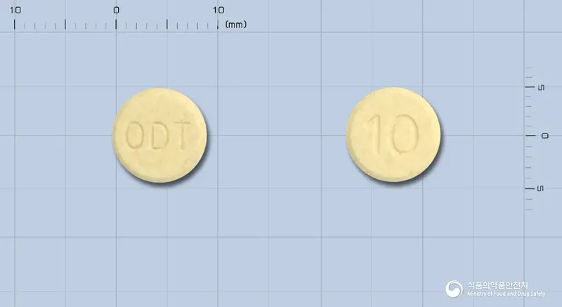 뉴로페질오디정10밀리그램(도네페질염산염일수화물) 앞뒤 사진 (노란색 원형, 각인 ODT / 10)