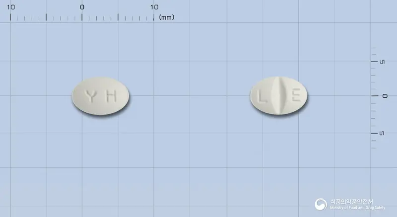 엘사팜정10mg(에스시탈로프람옥살산염)(수출용) 앞뒤 사진 (흰색 타원형, 각인 YH / L E)