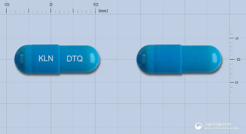 덴트큐캡슐 앞뒤 사진 (파란색 캡슐, 각인 KLN DTQ)