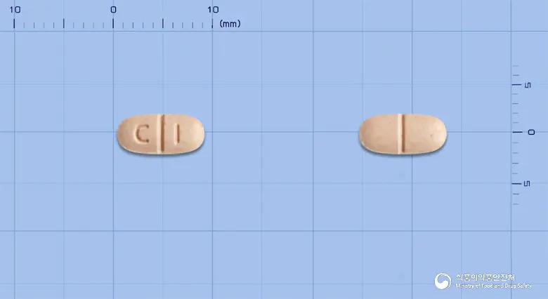 코위타칸정 앞뒤 사진 (분홍색 타원형, 각인 C I)