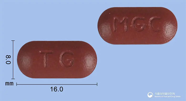 메가토스씨정 앞뒤 사진 (갈색 장방형, 각인 TG / MGC)
