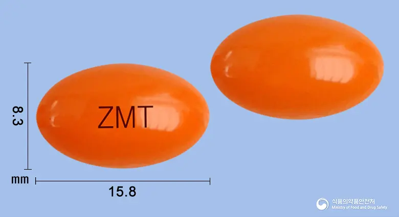 지메톨연질캡슐(옥수수불검화정량추출물) 앞뒤 사진 (주황색 캡슐, 각인 ZMT)