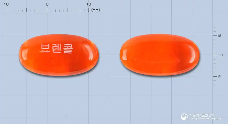 브렌콜연질캡슐 앞뒤 사진 (주황색·투명 캡슐, 각인 브렌콜)