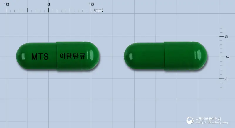 이탄탄 큐캡슐(수출용) 앞뒤 사진 (초록색 캡슐, 각인 MTS 이탄탄큐)