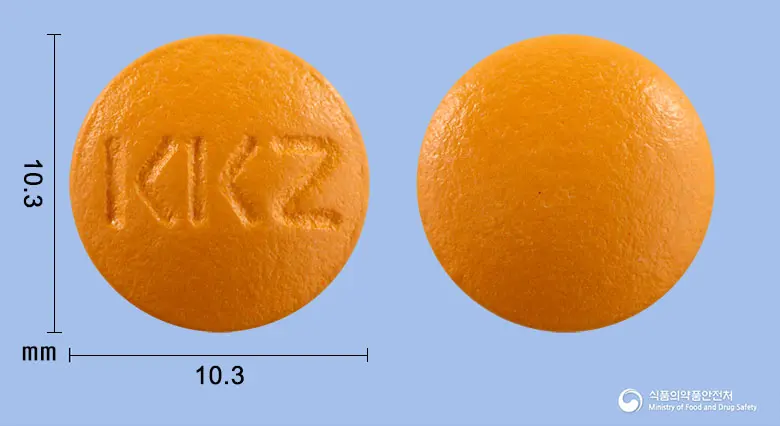 지메톨정(옥수수불검화정량추출물) 앞뒤 사진 (주황색 원형, 각인 KKZ)