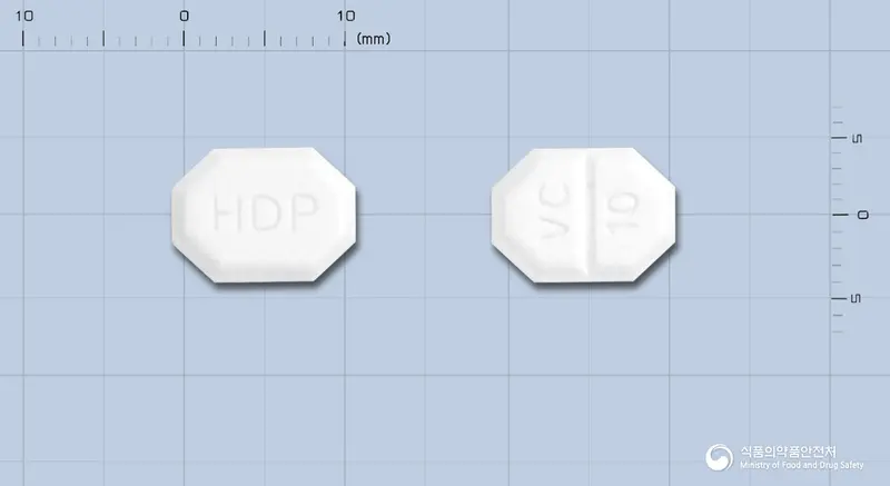 바로스크정10밀리그램(암로디핀베실산염) 앞뒤 사진 (흰색 팔각형, 각인 HDP / VC 10)
