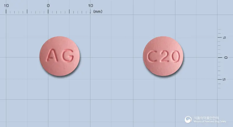 슈스타정20밀리그램(로수바스타틴칼슘) 앞뒤 사진 (분홍색 원형, 각인 AG / C20)