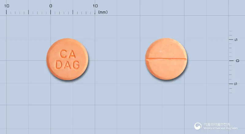 카엘정 앞뒤 사진 (분홍색 원형, 각인 CADAG)