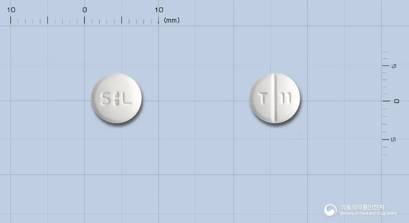텔미스정40mg(텔미사르탄) 앞뒤 사진 (흰색 원형, 각인 T 11)