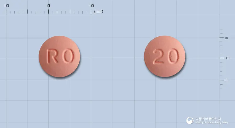로수토정20밀리그램(로수바스타틴칼슘) 앞뒤 사진 (분홍색 원형, 각인 RO / 20)