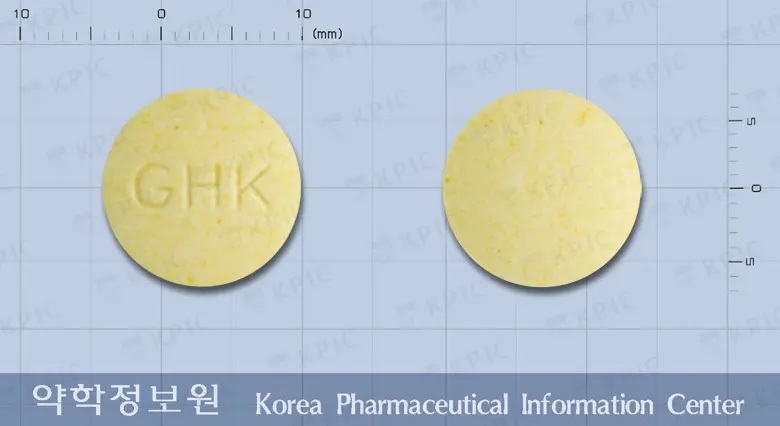 키즈빅츄어블정 앞뒤 사진 (노란색 원형, 각인 GHK)