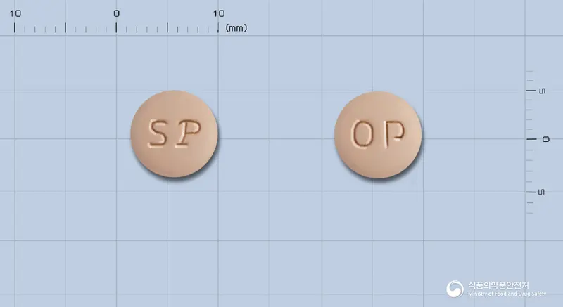 오메르텍플러스정 앞뒤 사진 (주황색 원형, 각인 OP)