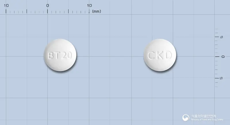 벨메텍정20밀리그램(올메사르탄메독소밀) 앞뒤 사진 (흰색 원형, 각인 BT20 / CKD)