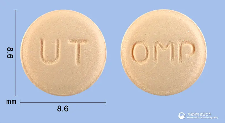 올레텐플러스정 앞뒤 사진 (주황색 원형, 각인 UT / OMP)