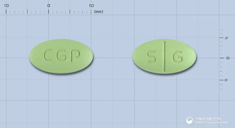 기네스타정 앞뒤 사진 (연두색 타원형, 각인 CGP / S G)