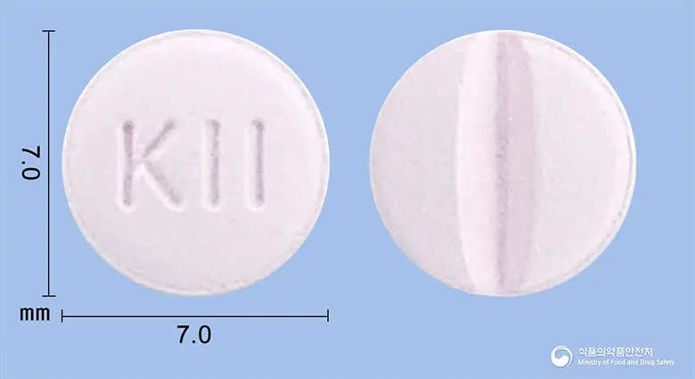 케이바로정(피타바스타틴칼슘수화물) 앞뒤 사진 (흰색 원형, 각인 KII)