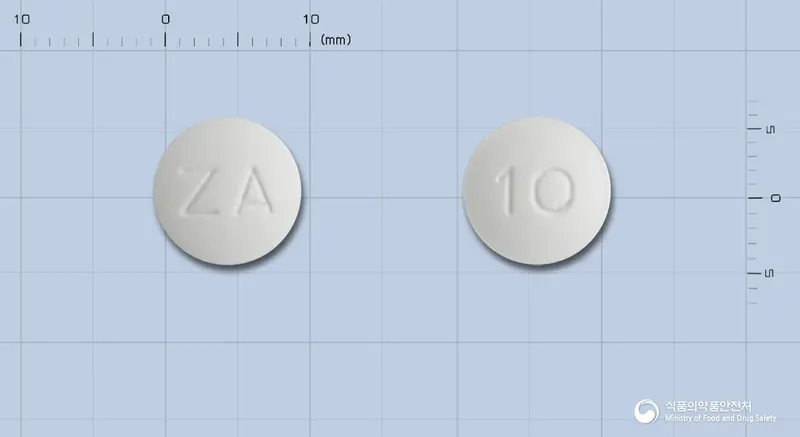 오자펙스정10밀리그램(올란자핀) 앞뒤 사진 (흰색 원형, 각인 ZA / 10)