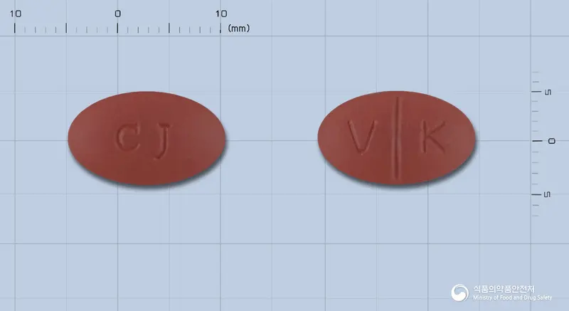 마하맥스정 앞뒤 사진 (갈색 타원형, 각인 V K)